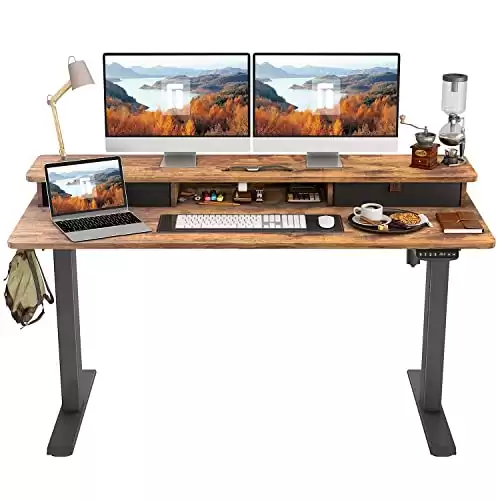 FEZIBO 55"x24" Height Adjustable Electric Standing Desk with Double Drawer, 55 x 24 Inch Stand Up Table with Storage Shelf, Sit Stand Desk with Splice Board, Black Frame/Rustic Brown Top